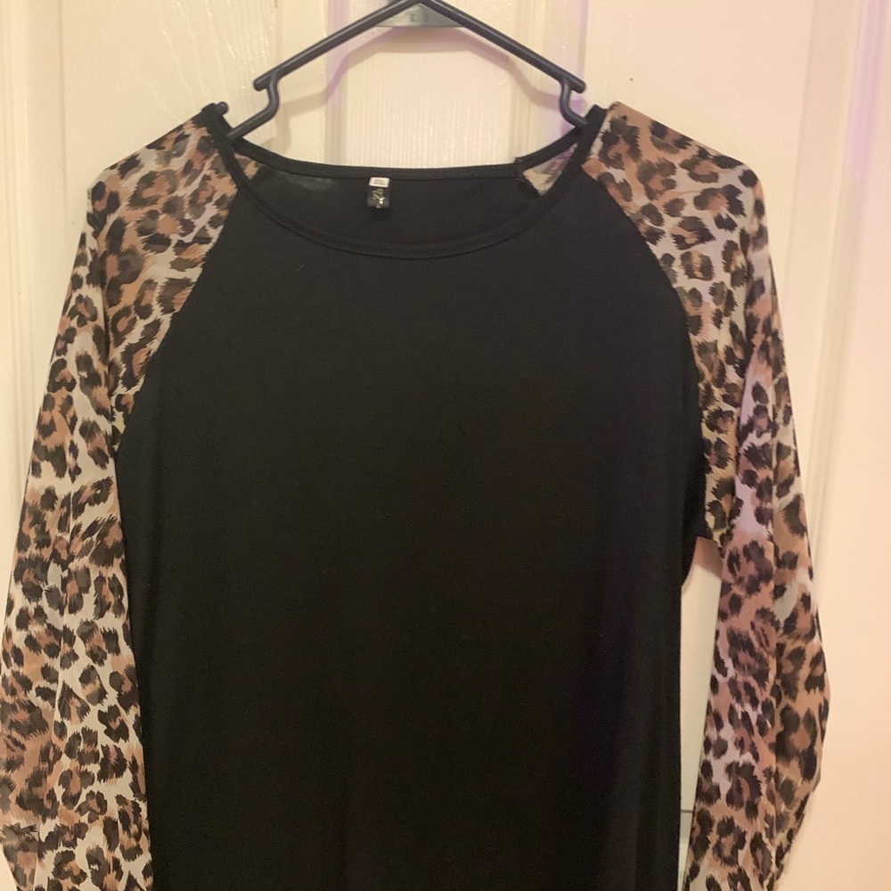 Amazing black shirt with leopard sleeves!